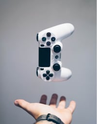 image of an hand and game controller